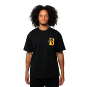 A person with curly hair faces forward against a plain white background, wearing the GANG AIN'T GANG NO MORE S/S TEE in black, which features a colorful embroidered letter B on the upper left chest.