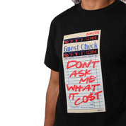 Wearing the GUEST CHECK S/S TEE BLACK, this person sports a black cotton shirt with a bold guest check graphic and "DONT ASK ME WHAT IT COST" in red. The tee’s retro distressed style stands out, though the person's head is partly out of frame.