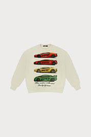The CAUTION TO THE WIND CREWNECK SWEATSHIRT CREME is a cream fleece featuring four vibrant supercars—red, orange, yellow, green—stacked across the front with cursive text below.