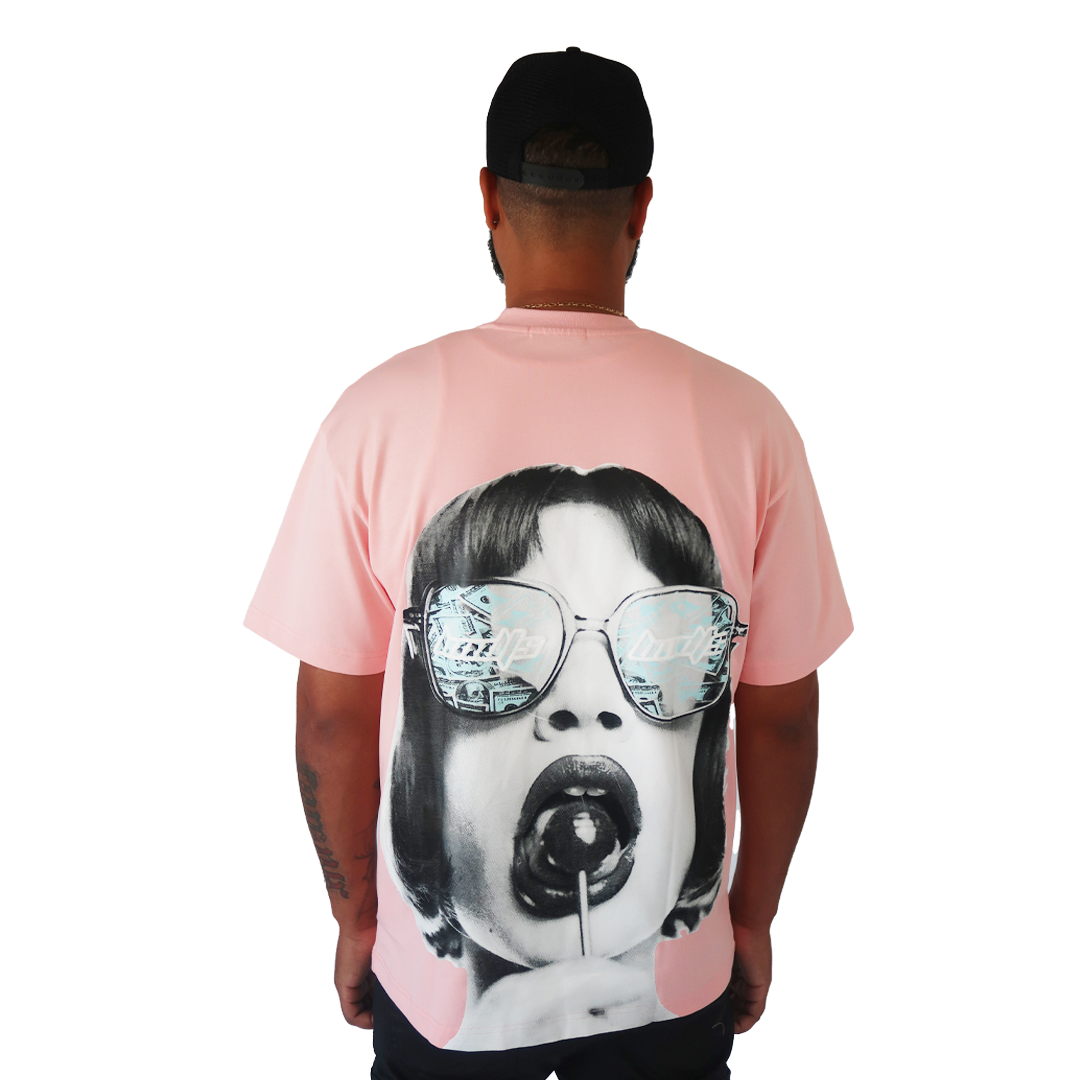 S TEE PINK by Bandits Apparel, an oversized tee with a large retro graphic of a woman in sunglasses holding a lollipop. "Candy" is reflected in her glasses against a plain white background.