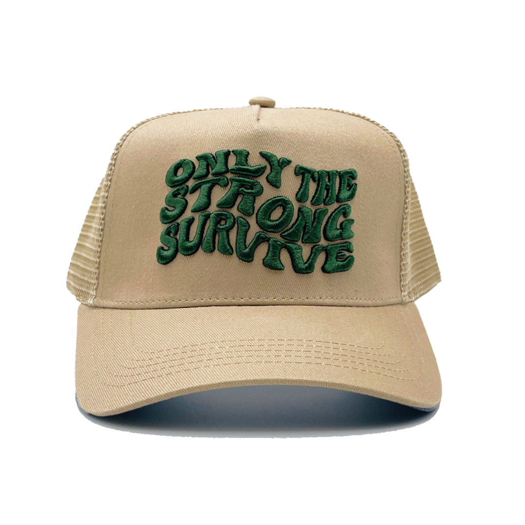 The ONLY THE STRONG SURVIVE TRUCKER is a beige hat with mesh sides, bold green wavy 3D embroidery on the front, and an adjustable snapback for a perfect fit.