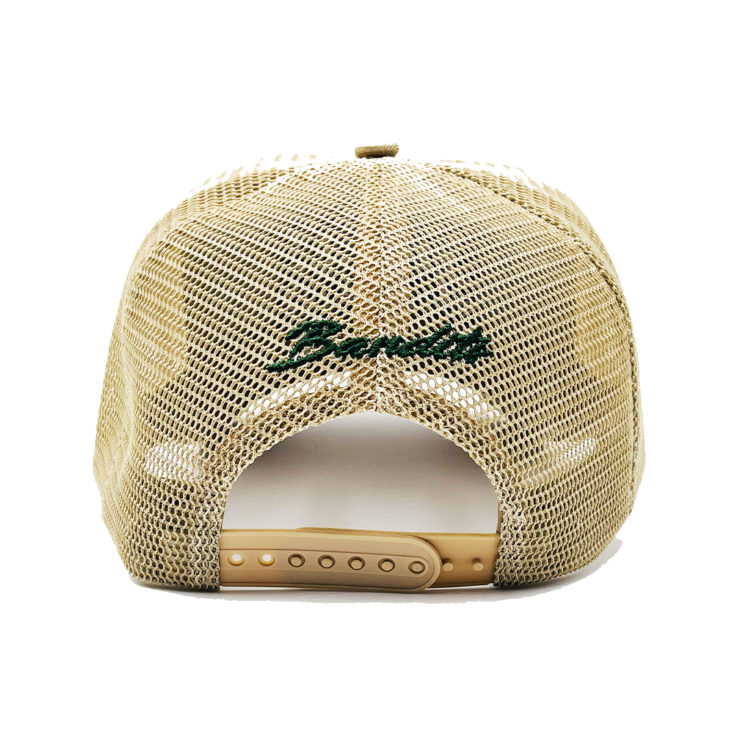 ONLY THE STRONG SURVIVE TRUCKER hat in beige mesh, shown from the back with an adjustable snapback and green 3D embroidery above the opening.