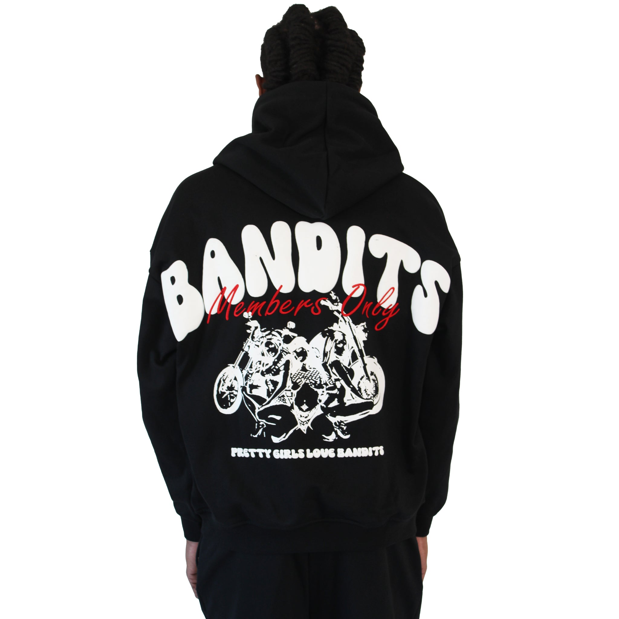 A person with long braids wears the BIKER CLUB PULLOVER HOODY BLACK, a heavyweight fleece hoodie with bold white BANDITS text, red Members Only script, "Pretty Girls Love Bandits," and a back graphic of women and motorcycles.