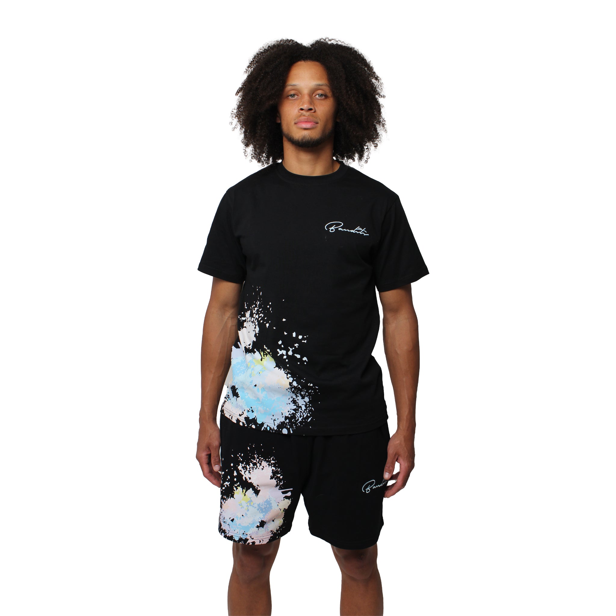 S TEE BLACK and matching shorts, both with colorful paint splatter embroidery on the left side, posing against a plain white background.